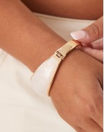 Curve bangle bracelet with faux pearl insert in gold tone