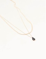 multirow necklace with black enamel charm pendant in gold tone